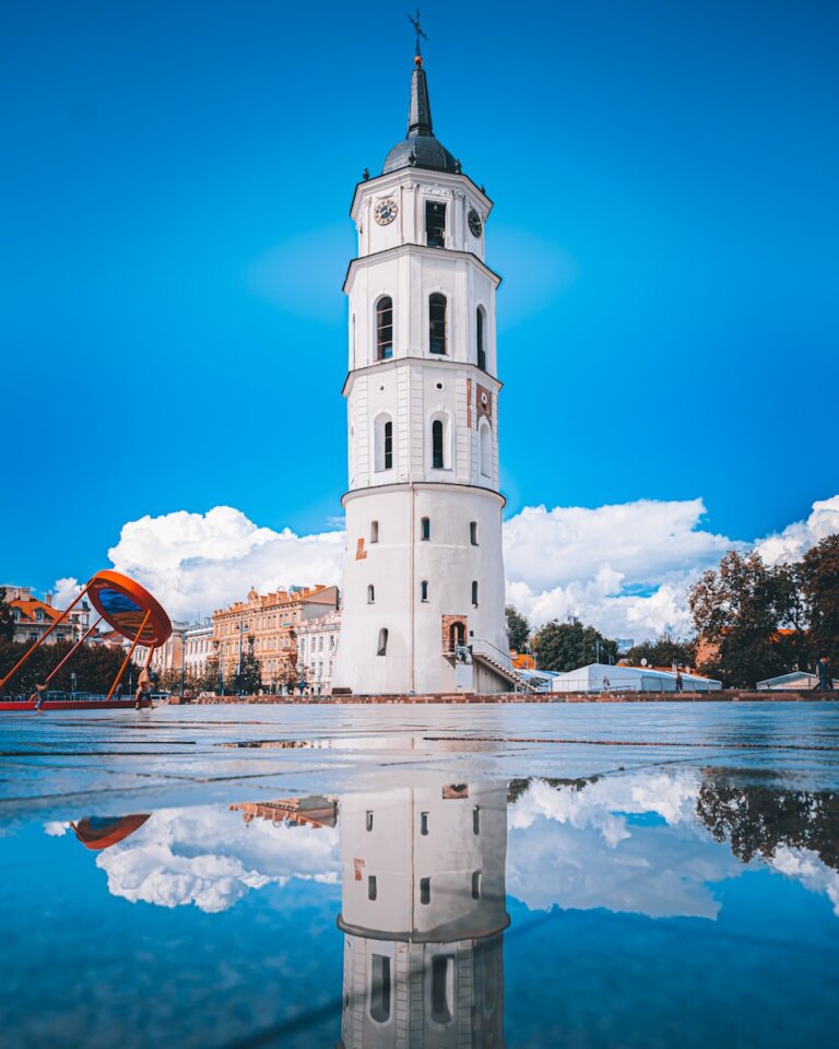 a white building with a clock tower